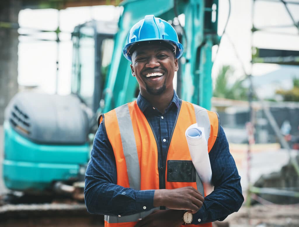 Portrait of a young man working at a construction site.